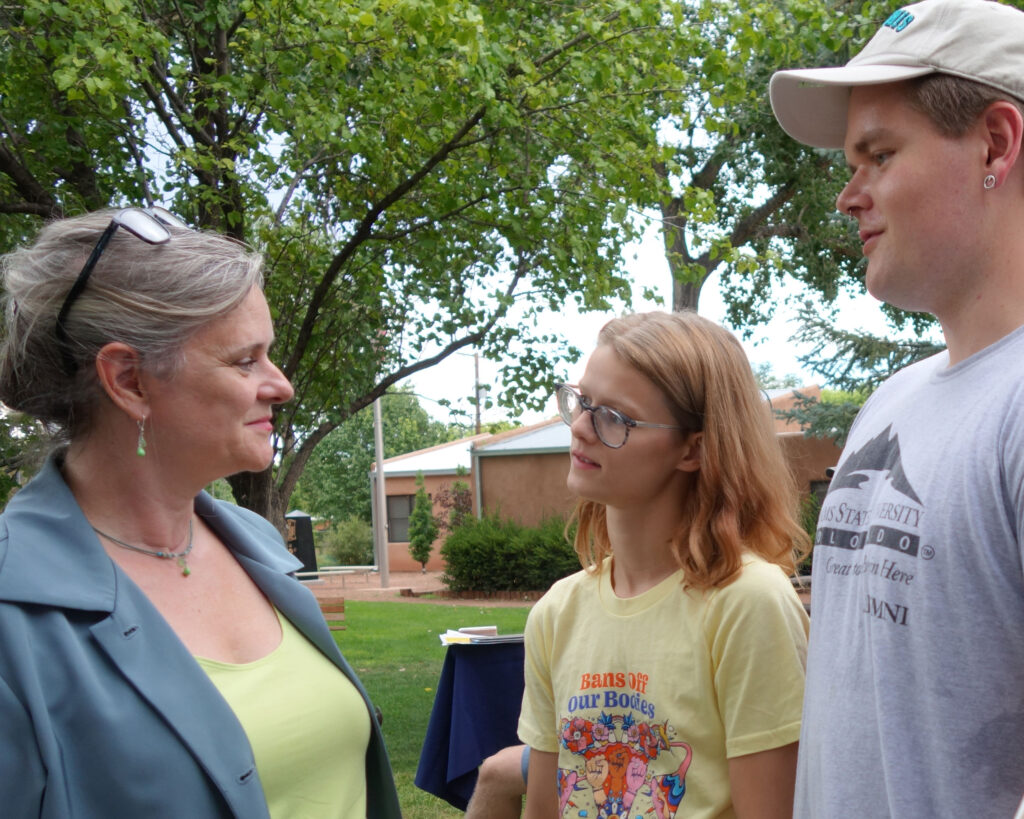 Kathleen talking with young voters